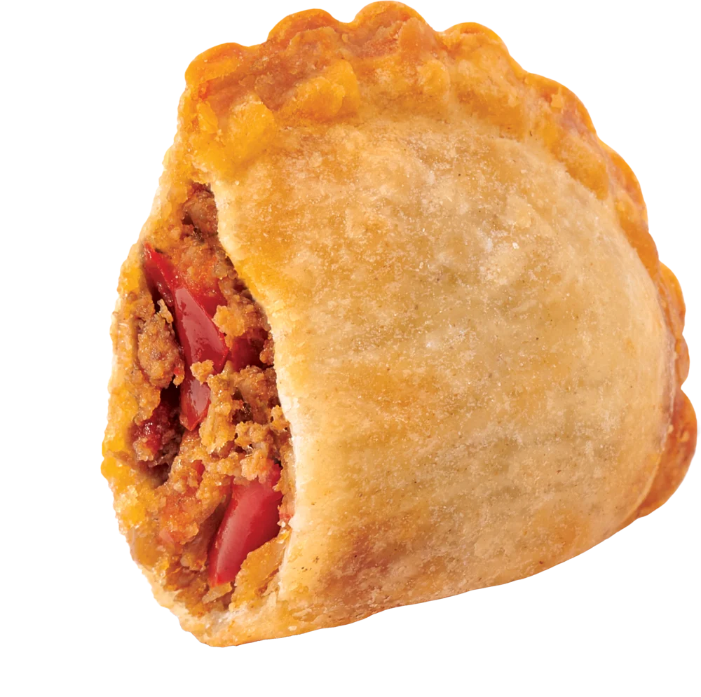 Golden empanada cut open to show seasoned beef filling